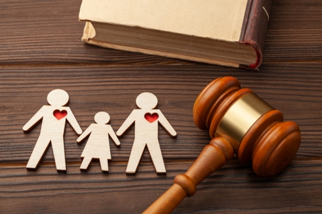Cut out family next to gavel